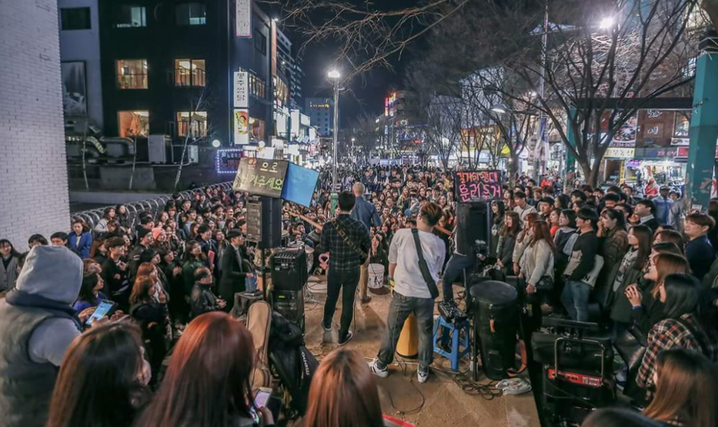 Hongdae is famous for street performances, live music, and vibrant nightlife in Seoul.