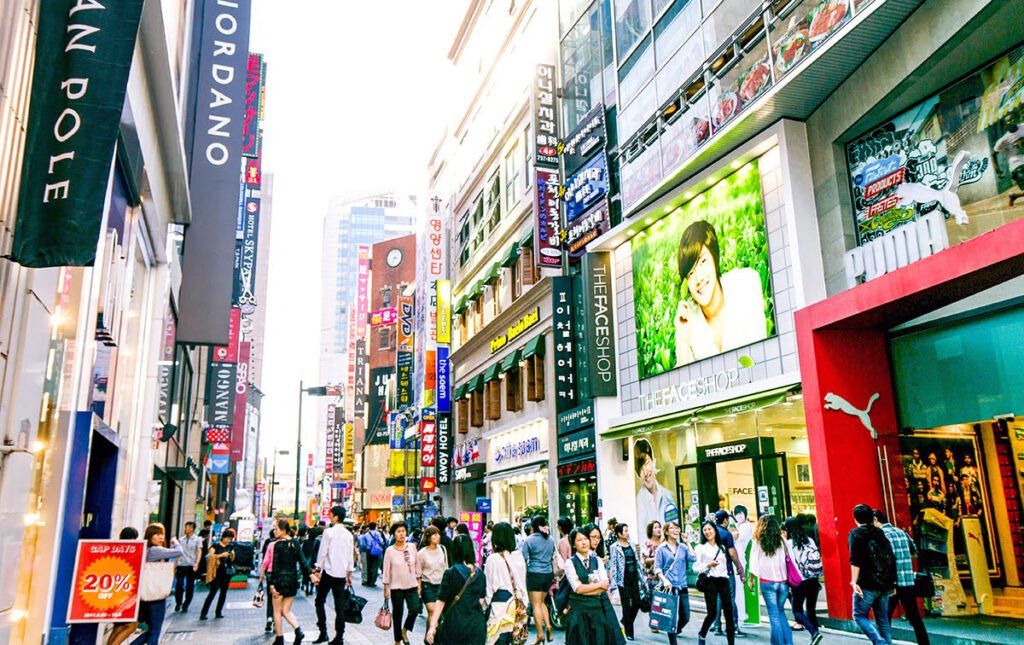 Tourists walking and shopping in Myeongdong shopping street in Seoul, South Korea