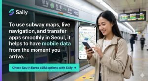 A young female traveler smiles while looking at a smartphone displaying a detailed navigation app map inside a Seoul subway station. Behind her, a subway train with bilingual signs like "Jamsil" is visible. On the left side of the banner, a dark text overlay states, "To use subway maps, live navigation, and transfer apps smoothly in Seoul, it helps to have mobile data from the moment you arrive." and includes a prominent teal button with the Saily brand logo that reads, "Check South Korea eSIM options with Saily →".