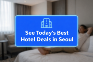 Blue hotel booking banner promoting Seoul hotel deals, shown over a blurred hotel room background with a traveler resting on the bed.