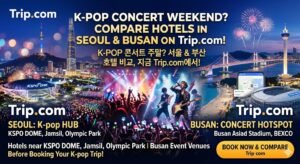 A promotional banner for Trip.com comparing hotels in Seoul and Busan for K-pop concert weekends. The image features Seoul's Lotte World Tower, KSPO Dome, and Busan's Gwangandaegyo Bridge with concert crowds and fireworks, highlighting venues like Jamsil and BEXCO
